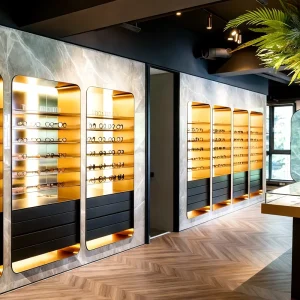 Modern Luxurious High End Eyewear Store LED Lighting Customizable Color Size Gold Illuminated Shelves Black Matte Cabinet Metal